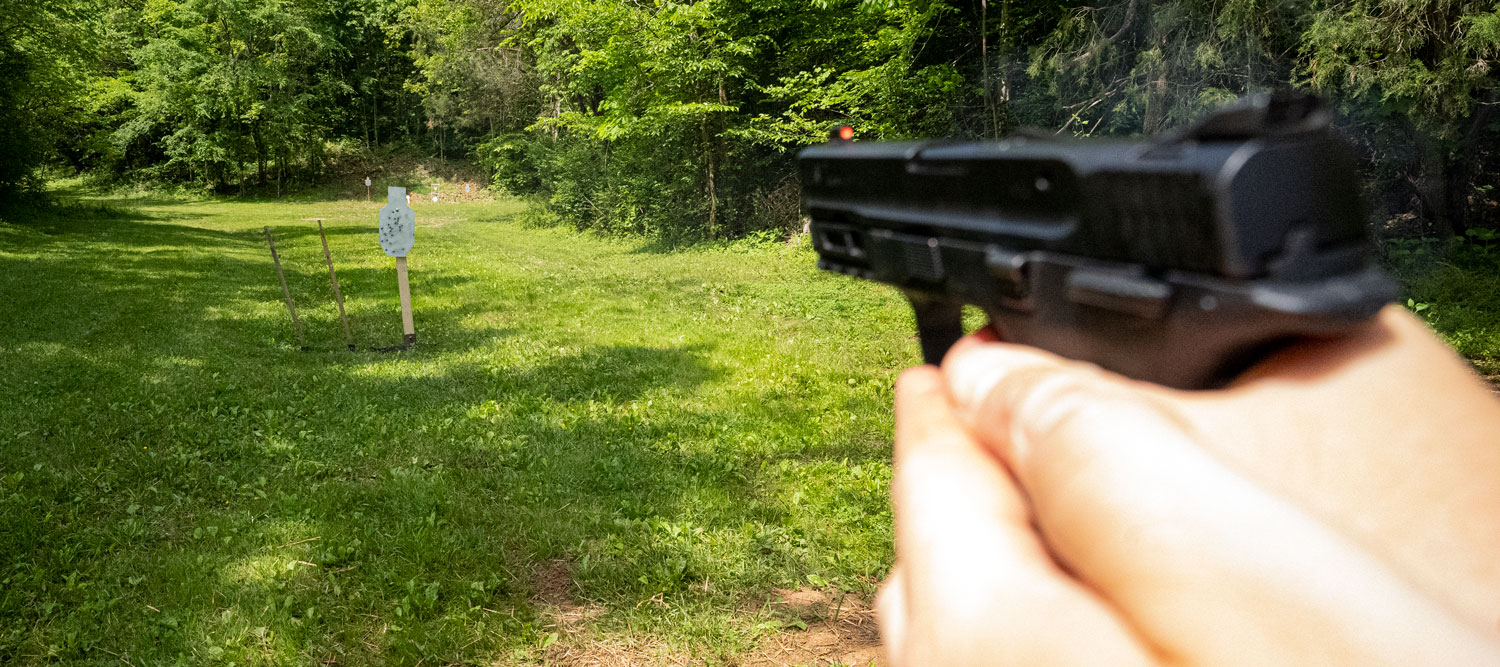 Firing a handgun at the shooting range
